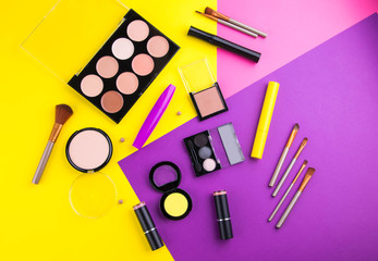 Decorative cosmetic set on colorful background