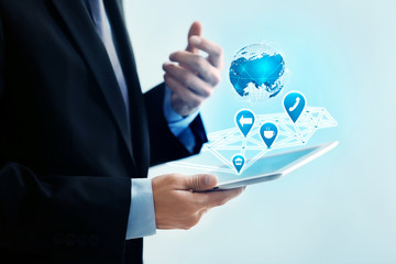 Businessman holding modern tablet, closeup