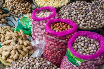 Onions in bags on grocery market in Vietnam.