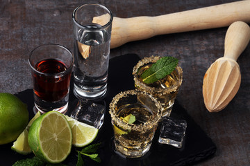 Selection of alcoholic drinks on rustic stone plate