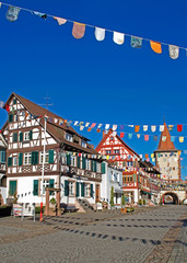 The historic old town of Gengenbach, Germany. Upper tower, fachwerk houses and Narrenzunft decorations