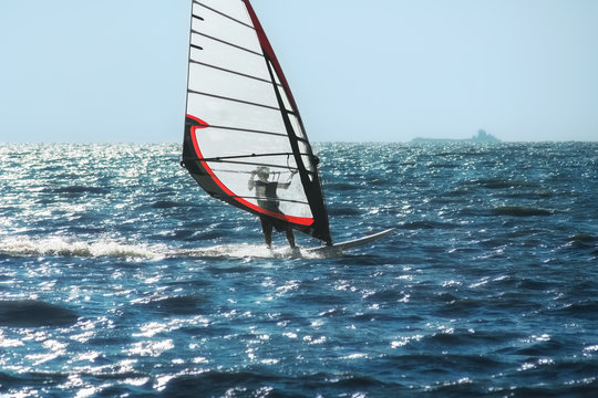 Windsurfing on the background of sea and sky