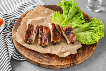 Yummy grilled sliced spare ribs on wooden plate