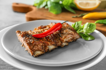 Delicious grilled spare ribs with chili on plate