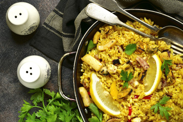 Traditional spanish (valencian) dish paella - stew with rice and seafood.Top view.