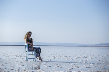 Lovely young woman sitting on chair salt lake