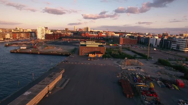 Aerial view of industrial area by the water in Malmo, Sweden. Apartment buildings and harbor