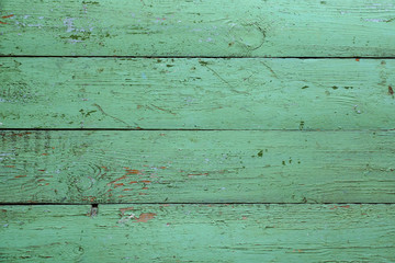 Fototapeta premium Old wooden green boards. Background. Fence or floor of green old boards.
