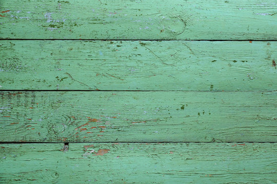 Fototapeta Old wooden green boards. Background. Fence or floor of green old boards.
