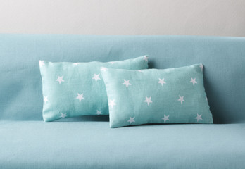 Pillows with star shape on the sofa