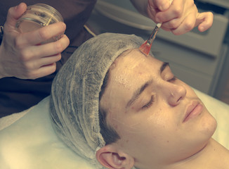 Face Care.  Smooth Skin. Cosmetology face care for a teenager  boy years old . toned.