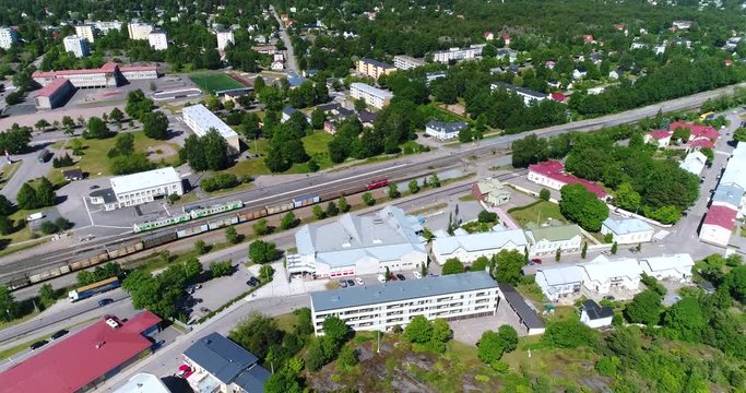 Train in the city, Cinema 4k aerial tilt view of a old train, in downtown Hanko, on Hango regatta day, in, Uusimaa, Finland
