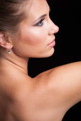 Fototapeta na wymiar beauty young blonde woman portrait profile studio
