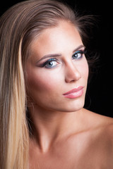 Fototapeta premium beauty young blonde woman portrait blue eyes studio