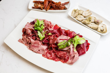 Italian Antipasto Platter Cold antipasto meat plate artichokes sundried tomato