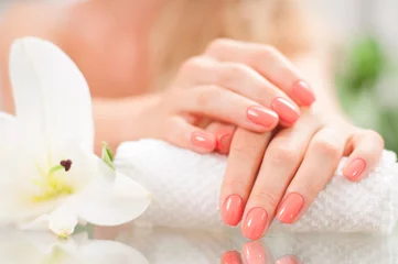 Wall murals Manicure Manicure concept. Beautiful woman's hands with perfect manicure at  beauty salon.