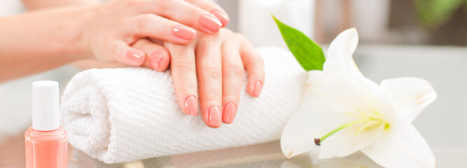 Obraz na płótnie Canvas Manicure concept. Beautiful woman's hands with perfect manicure at beauty salon.
