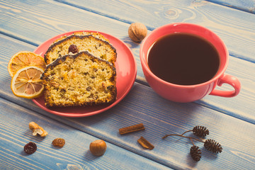Vintage photo, Cup of hot coffee and fresh baked homemade fruitcake