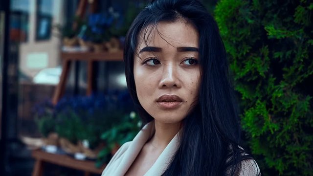 Portrait of a cute and gorgeous asian woman in fashion coat