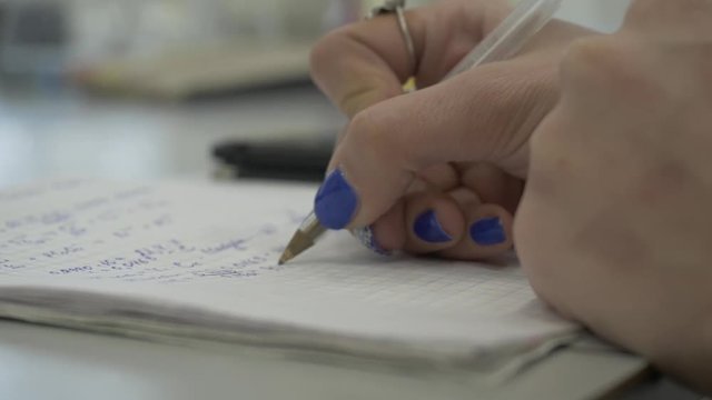 Girl considers checks on the calculator. Hands woman calculator money. Female office workers holding are arranging documents of unfinished documents archive analyzing the market