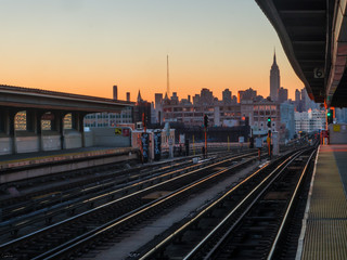 Train to NYC during sunset with the Empire State Building