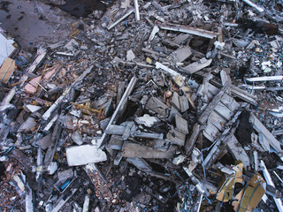 A process of buliding demolition, demolition site with heavy bulldozer and excavator with crushing...