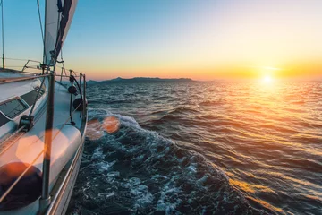 Photo sur Plexiglas Mer / coucher de soleil Luxury sailing ship yacht boat in the Aegean Sea during beautiful sunset.