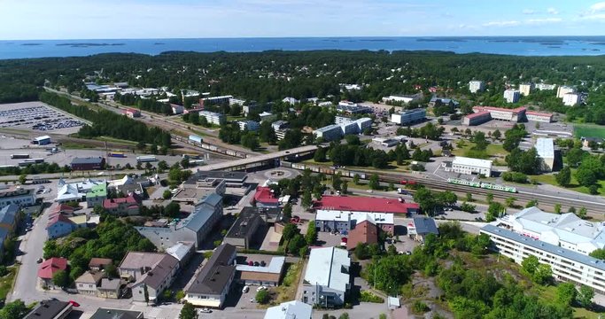 Cargo train in the city, Cinema 4k aerial tilt view of a old train, in downtown Hanko, on Hango regatta day, in, Uusimaa, Finland