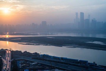 River And Modern Buildings Against Sky at sunrise/sunset in city of China.