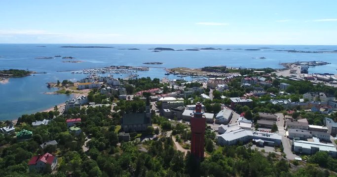 Hanko, Cinema 4k aerial view down to the water tower and the church, infront of the city, in Uusimaa, Finland