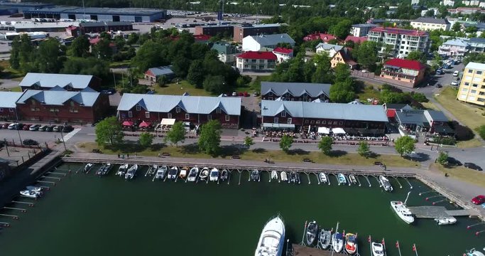 Hanko, Cinema 4k aerial view of Satamakatu restaurants, full of people on Hango regatta day, in Finland