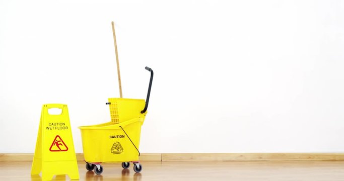 Mopping bucket with caution sign