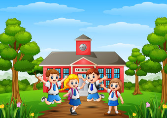 Fototapeta na wymiar Happy school children in front of school building