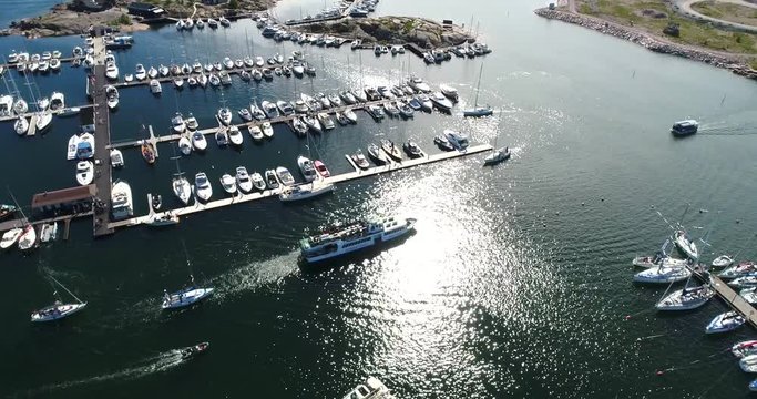 Ferry, Cinema 4k aerial view of bengtskar ferry bypassing other boats and heading towards hanko city in baltic sea, in the finnish archipelago of Finland