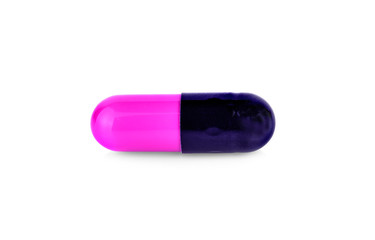 Purple pill capsule isolated on white background , closeup
