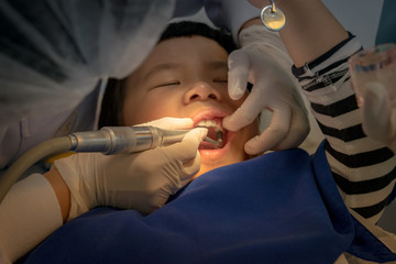 A boy teeth whitening and fluoride treatment