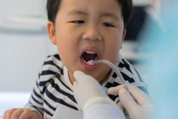 A boy teeth whitening and fluoride treatment