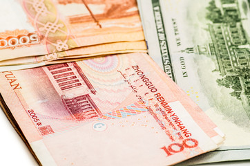 different currency banknotes. dollars, yuan and rubles on white