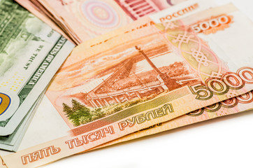 different currency banknotes. dollars, yuan and rubles on white