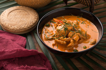 Thai style Red curry with Beef menu or Thai name is panaeng neur. Beef menu with coconut milk.Panaeng Curry with Pork on Wooden table
