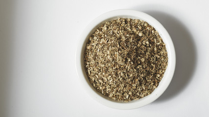 Bowl of dried oregano leaves