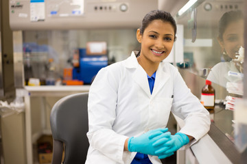 Closeup portrait, scientist posing in front of fume hood, performing laboratory experiments, isolated lab background. Forensics, genetics, microbiology, biochemistry