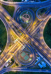 Aerial view, Road roundabout, Expressway with car lots in the city in Thailand.  beautiful Street , downtown, cityscape, Top view. Background