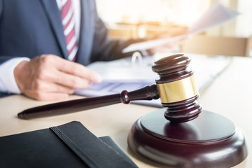 gavel and sound block of justice law and lawyer working on wooden desk background