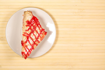 Tasty sweet piece of cake on wooden background