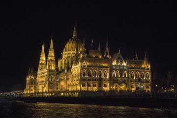 Budapest Parliament in Hungary at night on the Danube river