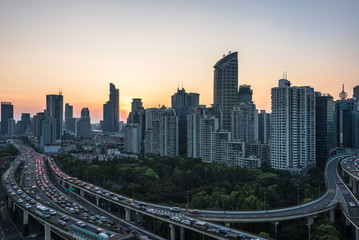 Fototapeta na wymiar panoramic view of cityscape,midtown skyline at sunrise/sunset,shot in China.