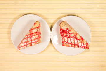 Tasty sweet piece of cake on wooden background