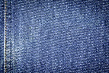 Naklejka premium Denim jeans fabric texture background with seam for beauty, fashion and clothing idea concept design.