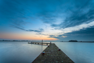 Obraz na płótnie Canvas Blue dusk over a tranquil lake